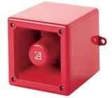 A red audible alarm sounder with a square shape and a central circular opening on the front face, designed for outdoor use.