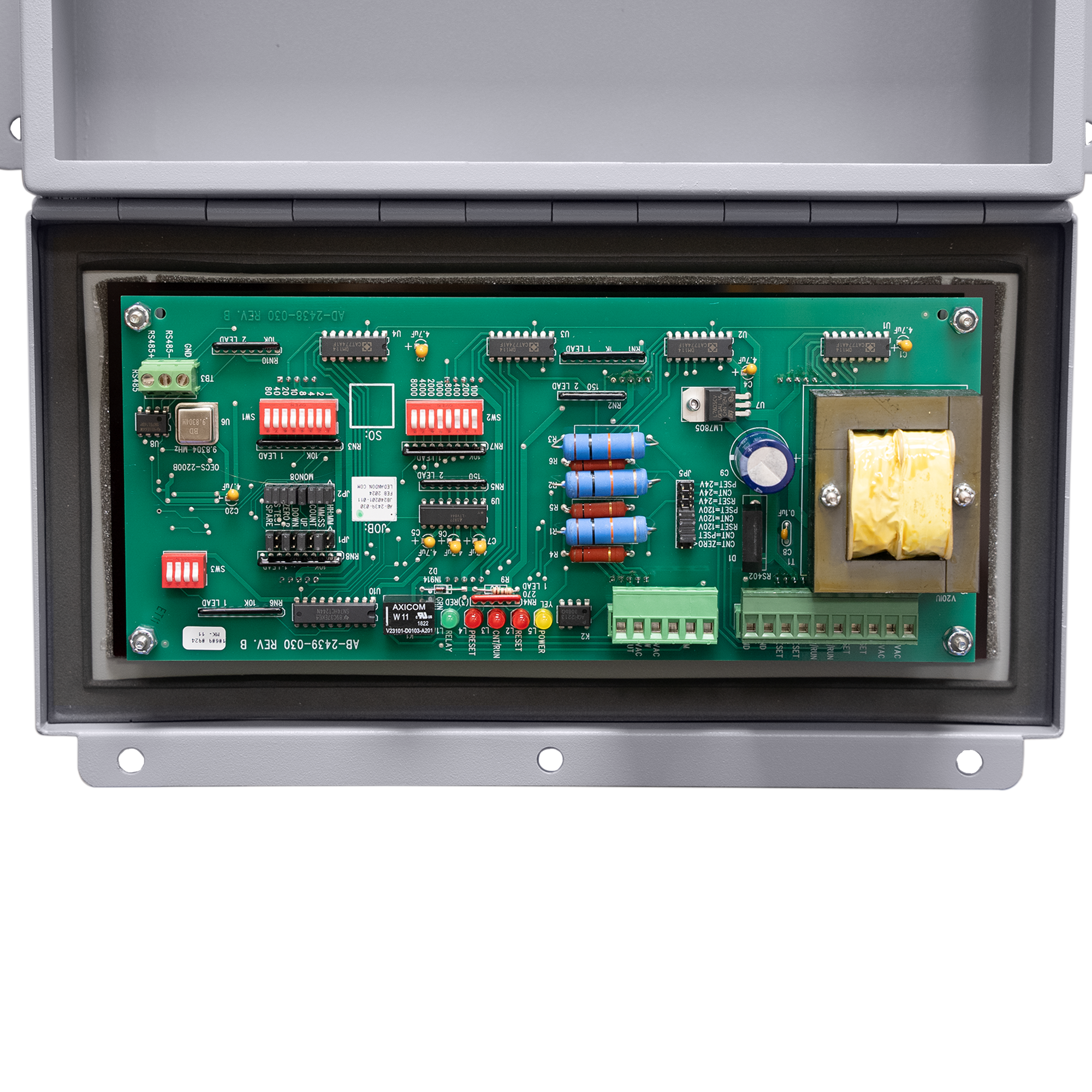 Electronic circuit board with various components on a white background