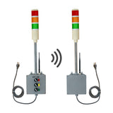 Two industrial signal lights with control panels on a white background.