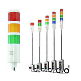 Set of industrial signal lights with red, amber, green, blue and white lenses on a white background.