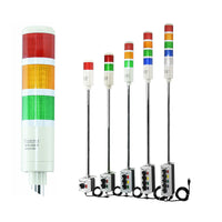 Set of industrial signal lights with red, amber, green, blue and white lenses on a white background.