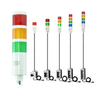 Collection of multicolored industrial signal lights with 2-position switches on a white background