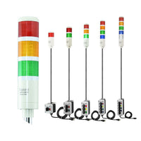 Collection of multicolored industrial signal lights with 3-position switches on a white background