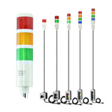 Collection of multicolored industrial signal lights with 3-position switches on a white background.