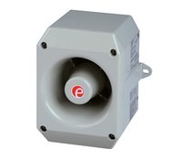 A gray metal industrial speaker with a red marking on the front.