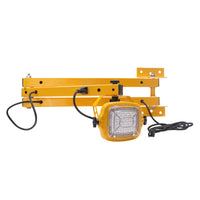 Yellow metal bracket with a light fixture on a white background