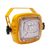 Yellow floodlight with clear lens on a white background.