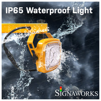 Swing arm dock light demonstrating it's IP65 waterproof rating during inclement weather conditions.