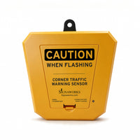 Yellow traffic warning sensor with 'Caution When Flashing' text on a white background