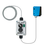 Wired control box with buttons and wiring on a white background