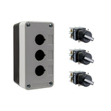 Black and grey push button box with three holes, held together by four phillips head screws next to three black and white 2-position selector switches on a white background.