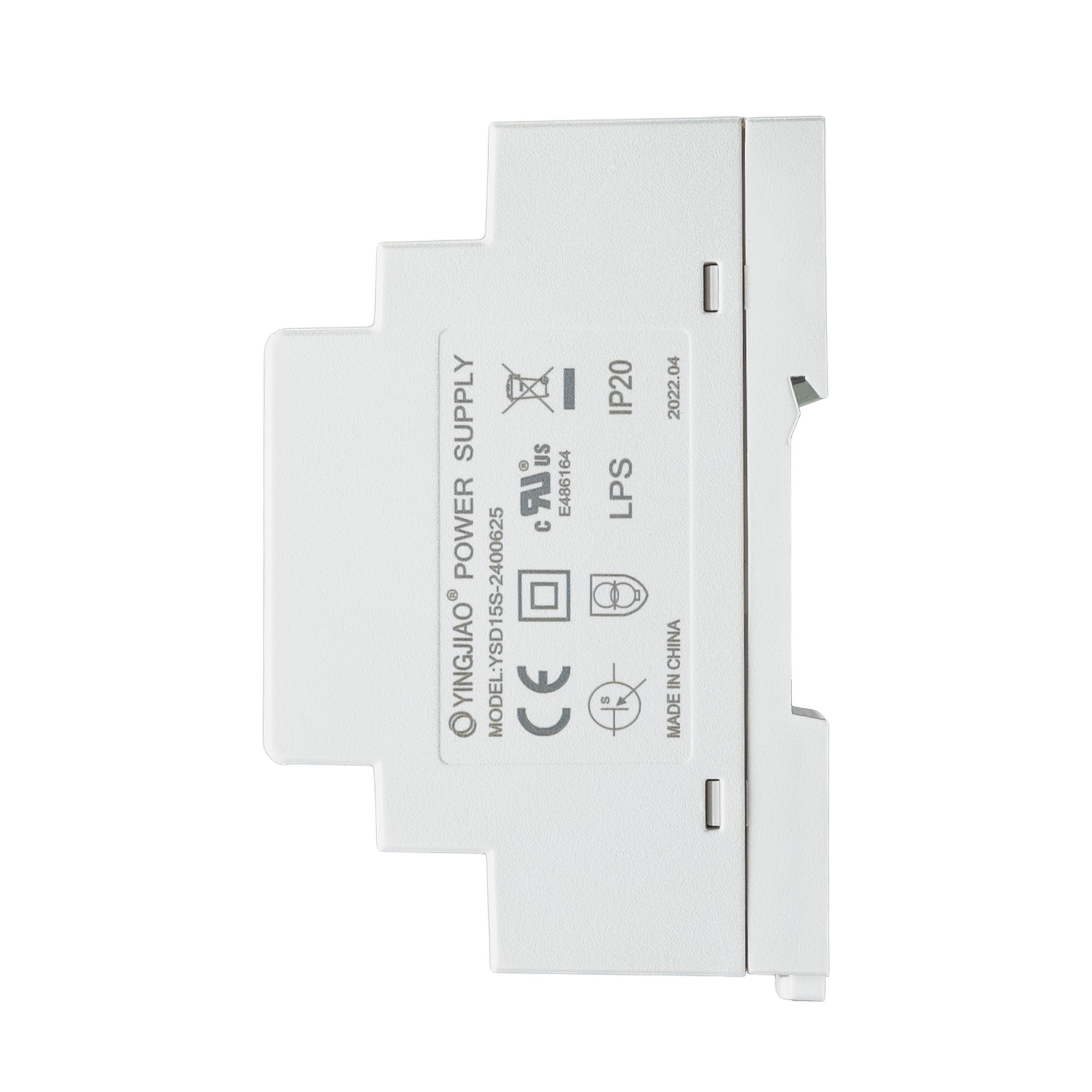Side perspective of white DIN rail-mounted power supply with labeling.