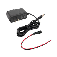 Black power adapter with a black and red cable on a white background.