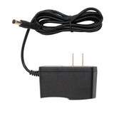 Black power adapter with a coiled cable on a white background
