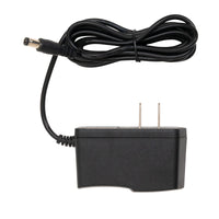 Black power adapter with a coiled cable on a white background