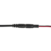 Black cable connector with red and black wires on a white background