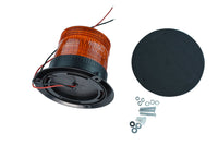 A large LED strobe light with a circular amber lens designed for industrial signaling with a black base and mounting hardware on a white background.