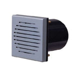 Square metal speaker cover with black circular housing on a white background.