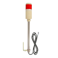Four-Color industrial pole-mounted tower light with black cable and red prism lens on a white background.