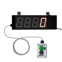Digital display with red LED digits and a control box with green and black buttons on a white background.