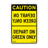 Yellow and black sign with mirrored text on top half stating, "DEPART ON GREEN ONLY."