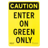 Black and yellow sign stating, "ENTER ON GREEN ONLY," on a white background.