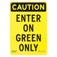 Black and yellow sign stating, "ENTER ON GREEN ONLY," on a white background.