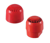 Two red electronic audible alarm units with vents on a white background.