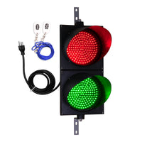 Traffic light with red and green lights, cable, and keychain on a white background