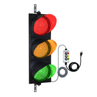 Traffic light with red, amber and green lights with a 2-position switch control box on a white background.