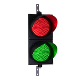 Red and green 12 inch traffic light on a white background.