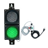 Traffic light system with green LED light, control box  and cables on a white background.