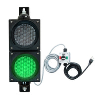 Traffic light system with green LED light, control box  and cables on a white background.