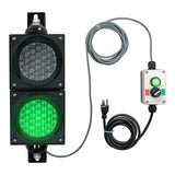 Traffic light system with green signal and control box on a white background.