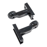 Two black plastic wall-mounted brackets on a white background.