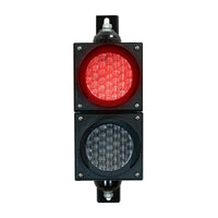 Red four inch traffic light with black plastic housing and mounting brackets.