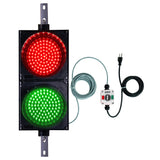 Traffic light with red and green lights, wiring and 3-Position control box on a white background.