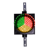 An 8 inch diameter 3-in-1 lens LED stop-go loading dock traffic light with red, amber, and green colors, featuring a polycarbonate housing and two right angle mounting brackets.
