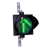 An 8 inch diameter LED traffic light signal featuring a green arrow in a black polycarbonate housing on a white background.