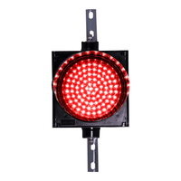 Red 8 inch traffic light on a white background.