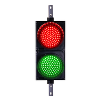 8 inch traffic light illuminated in red and green on a white background.