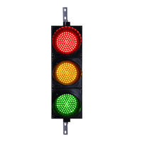Triple 8 inch red, amber and green wireless traffic light with black key fob set on a white background.