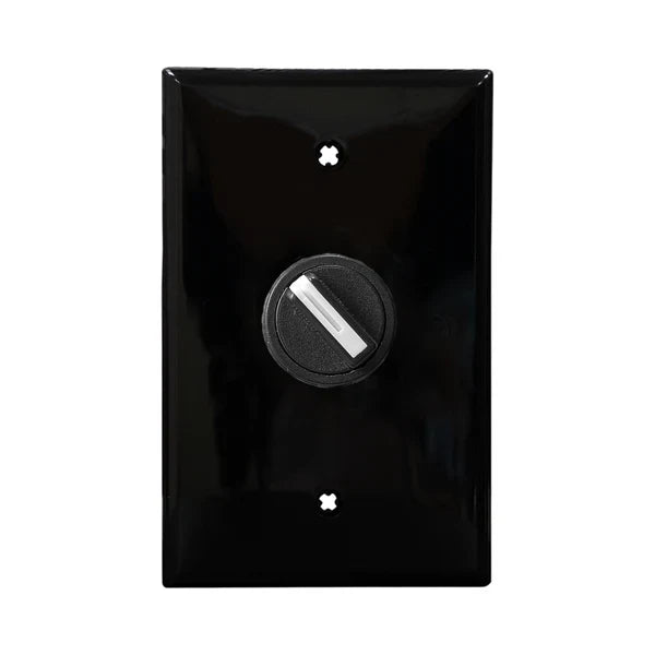 A black wall plate and 2-position selector switch mounted on a white wall, with a central black dial for changing positions.