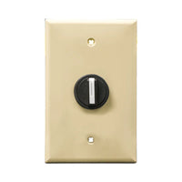 A ivory wall plate and black 3-position selector switch mounted on a white wall plate on a white background.