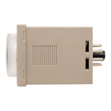 Side profile of tan timer with clear dial and four visible pins on rear.